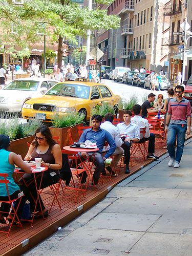 Inviting Outdoor Cafe Design Blends Vibrant Atmosphere with Urban Life