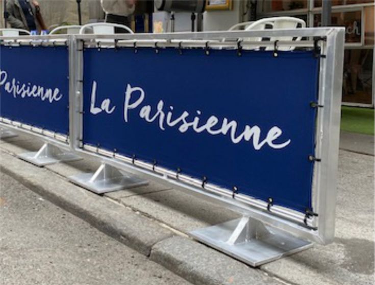 Chic Outdoor Cafe Setup with Navy Blue Barriers for a Cozy Urban Dining Experience