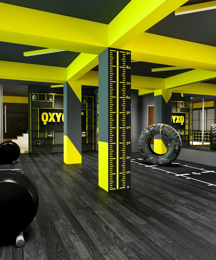 Dynamic Gym Interior Blends Bold Yellow Accents with Sleek Dark Gray for a Motivating Atmosphere