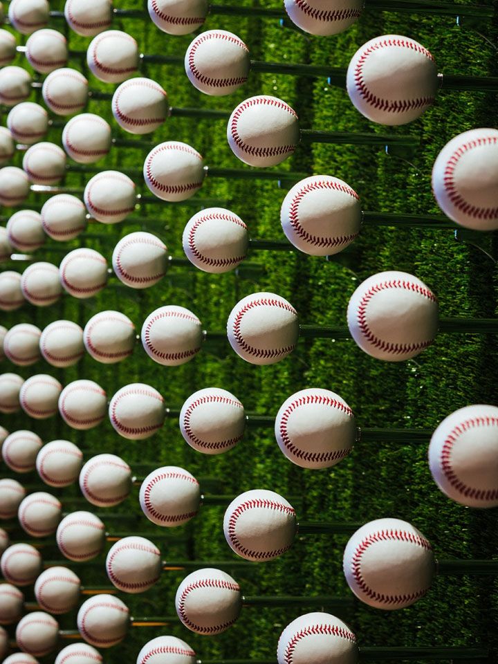 Vibrant Baseball Wall Installation: A Sporty Focal Point for Engaging Cafe Atmosphere