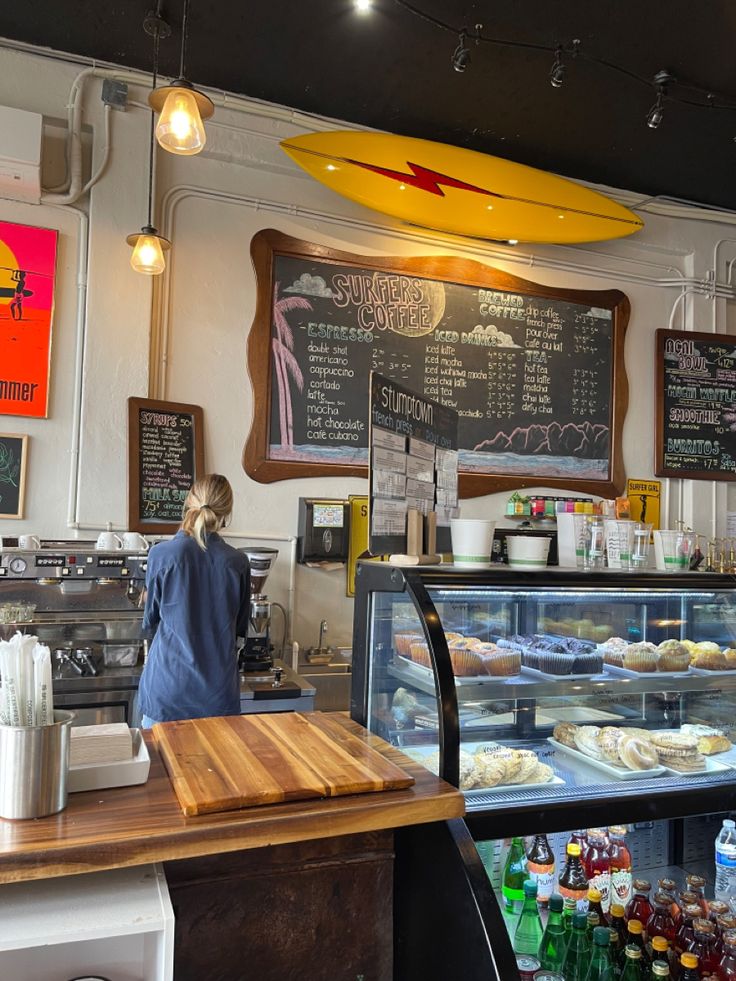 Vibrant Beachy Cafe: Surf-Inspired Decor, Cozy Atmosphere, and Tempting Baked Goods