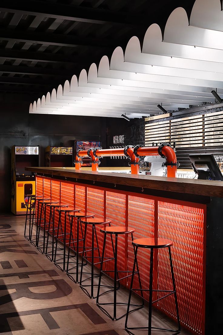 Striking Industrial Cafe Design: Bold Bar Area with Modern Elements and Inviting Warmth