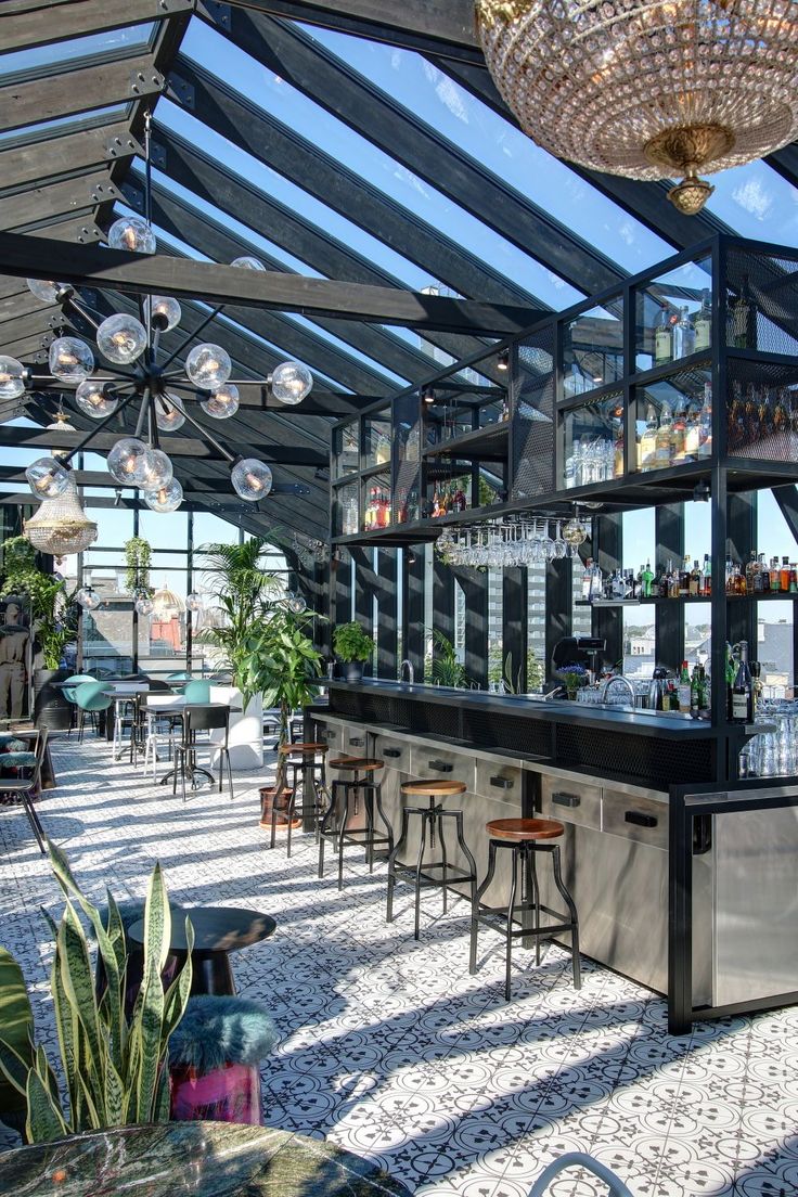 Modern Cafe Design: Expansive Glass Ceiling, Stylish Bar, and Elegant Decor Create Inviting Atmosphere