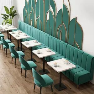 Modern Cafe Design: Cozy Atmosphere with Vibrant Teal Upholstery and Elegant Decor