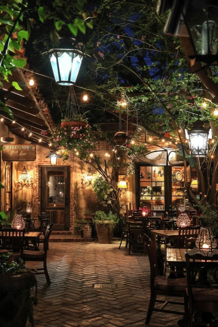 Charming Outdoor Cafe Design: Inviting Lanterns, Rustic Furnishings, and Cozy Ambiance