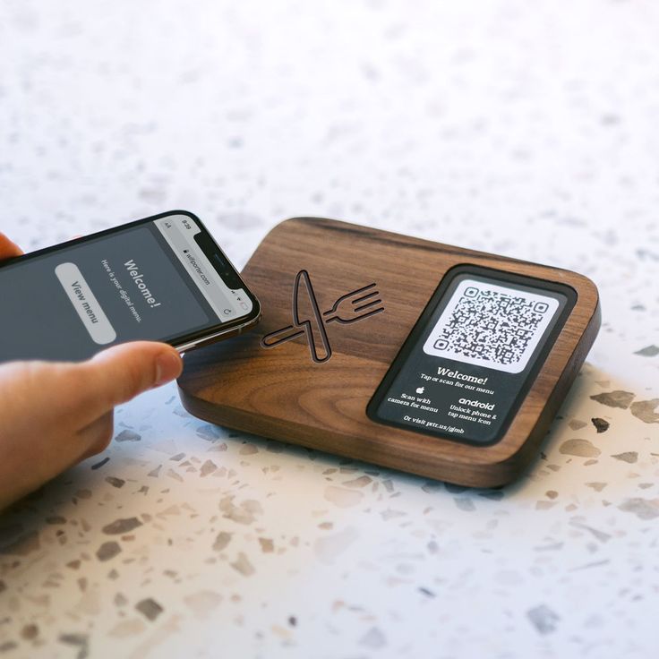 Modern Cafe Design: Sleek Wooden Coaster with QR Code and Elegantly Engraved Cutlery