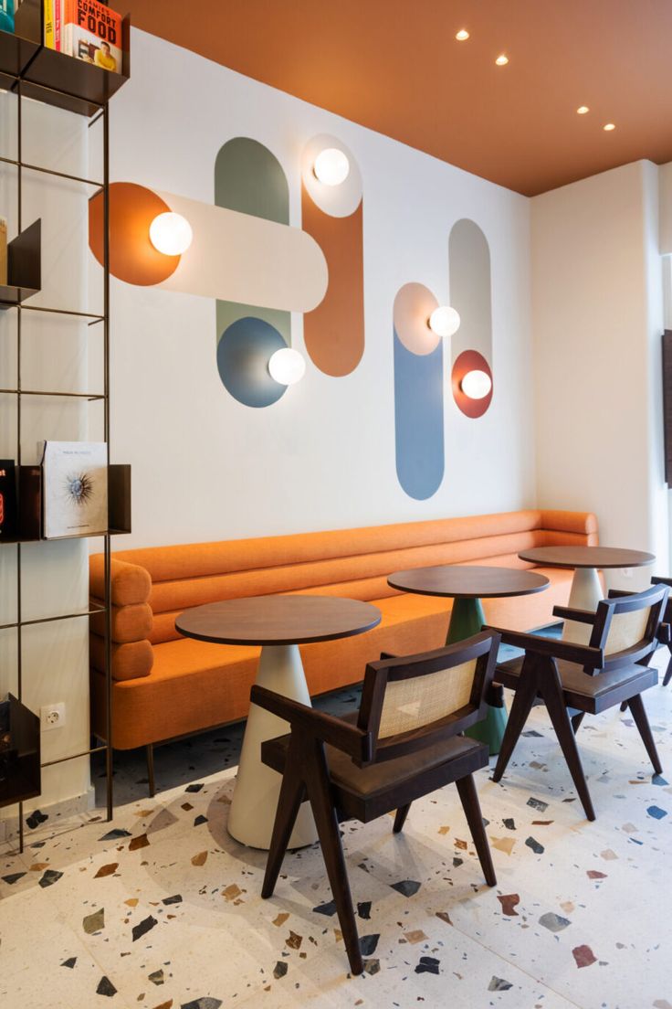 Vibrant Modern Cafe Design Blending Cozy Seating with Bold Aesthetics