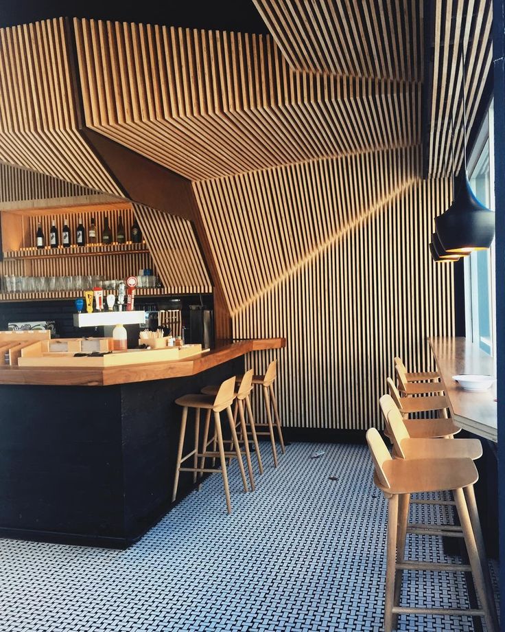 Striking Cafe Design Fuses Geometric Shapes with Natural Materials for a Warm, Modern Atmosphere