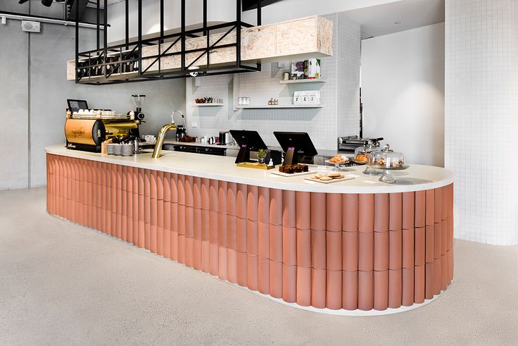 Modern Cafe Design: Striking Curved Counter and Inviting Aesthetic Enhance Social Interaction