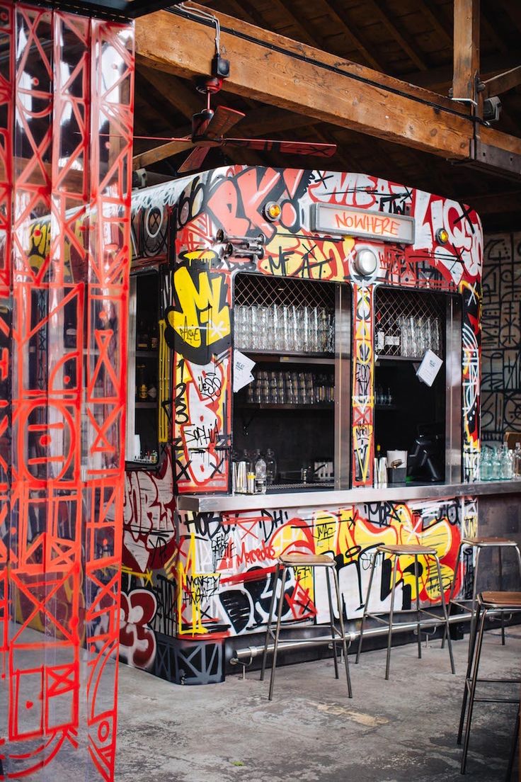 Vibrant Cafe Design: A Playful Fusion of Graffiti and Industrial Elements