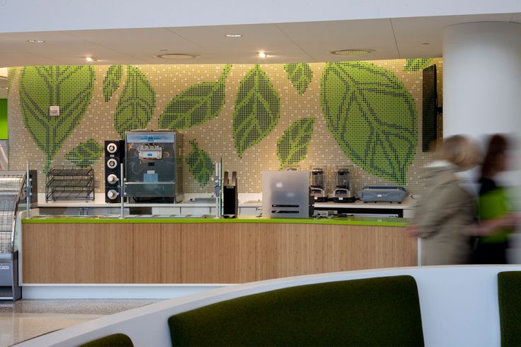 Modern Cafe Design: Inviting Atmosphere with Green Motifs and Functional Layout