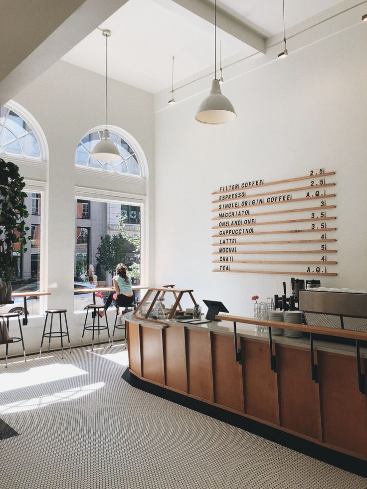 Stylish and Inviting Cafe Design Balances Modern Minimalism with Natural Light and Cozy Elements