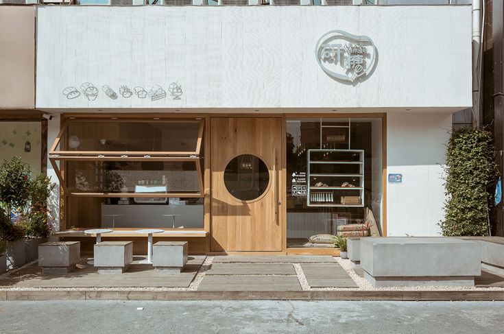 Modern Cafe Design Combines Clean Lines, Natural Materials, and Welcoming Outdoor Space