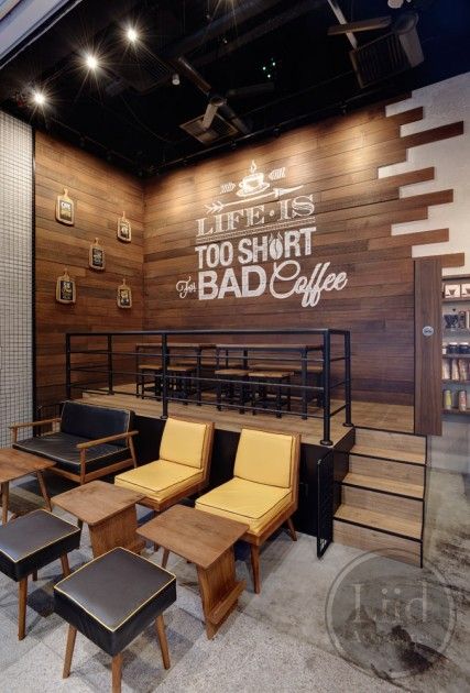 Inviting Cafe Design Blends Warm Wood Textures and Modern Furnishings for a Cozy Atmosphere