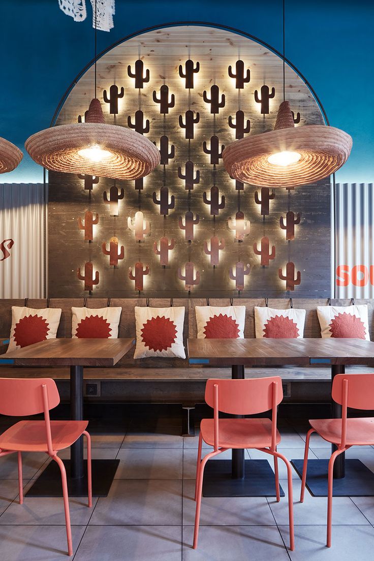 Vibrant cafe design harmonizes playful cactus motifs with modern elements for a stylish, inviting atmosphere