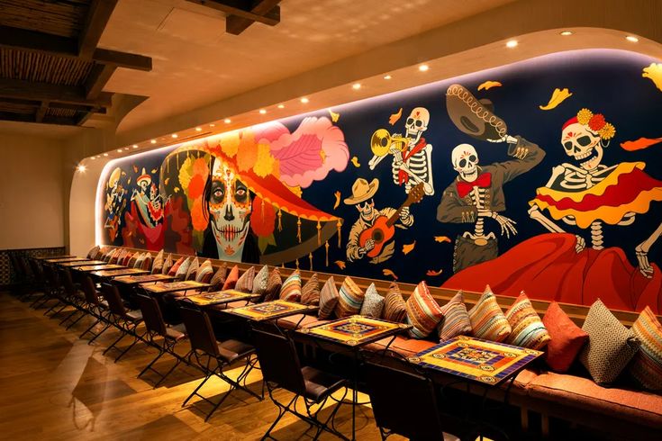 Vibrant Cafe Murals and Cozy Seating Create an Inviting Atmosphere for Festive Gatherings