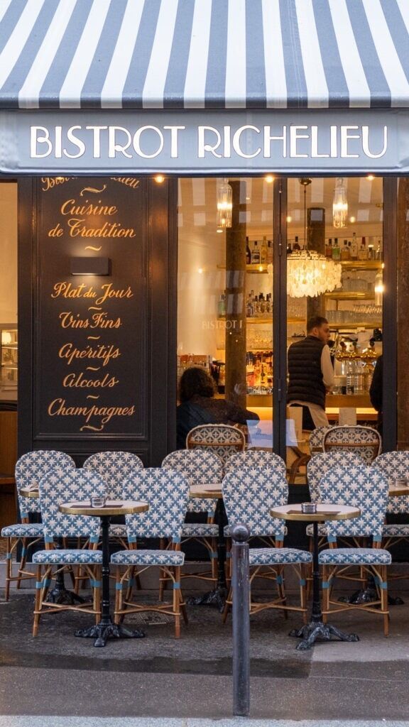 Charming Parisian Cafe: A Cozy Retreat for Social Dining and People-Watching