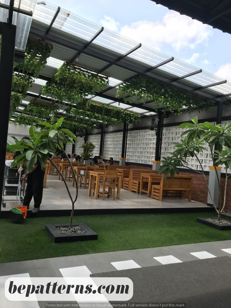 Inviting Cafe Design Blends Open-Air Layout with Natural Elements for a Modern, Serene Atmosphere