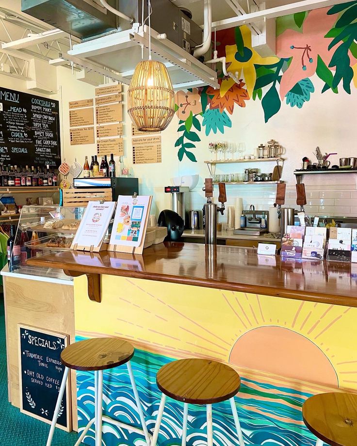 Charming Cafe with Tropical Mural and Beachy Ambiance for Relaxation and Socializing