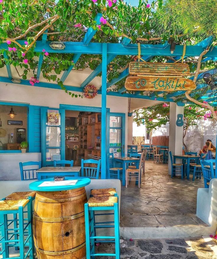 Charming Coastal Cafe Design with Vibrant Outdoor Seating and Inviting Atmosphere