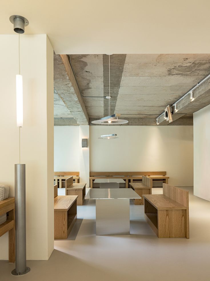 Minimalist Cafe Design Blends Natural Materials with Modern Industrial Elements for a Serene Atmosphere