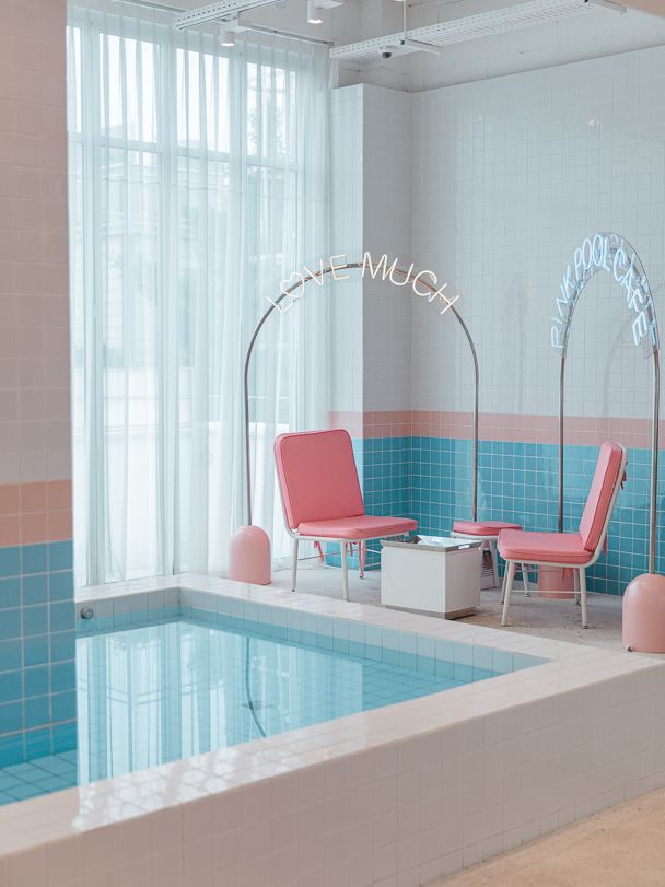 Trendy Cafe Design: A Playful, Airy Space with Pastel Palette and Unique Pool Focal Point