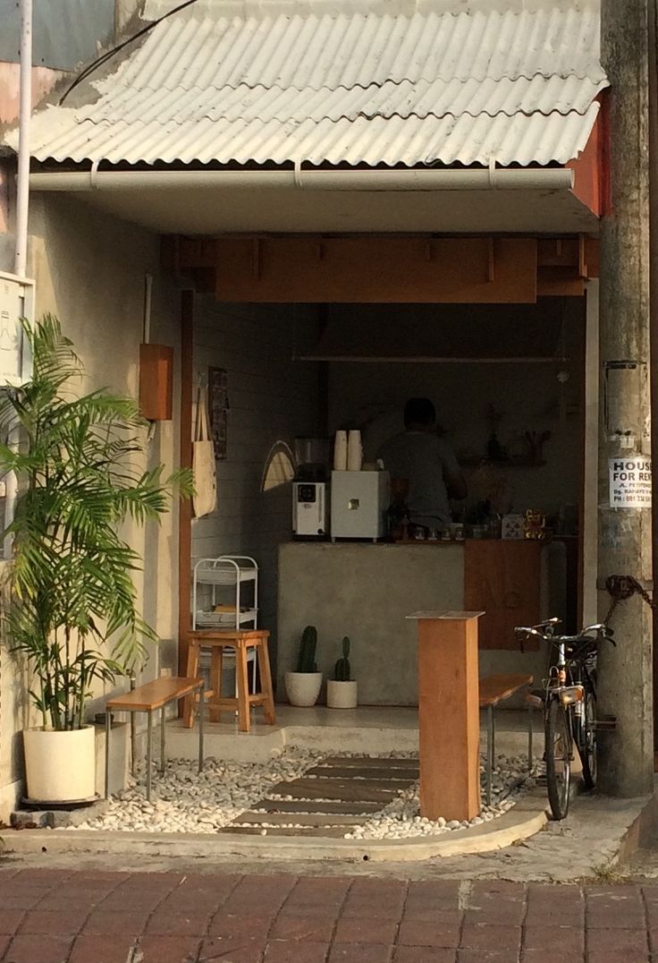 Chic Minimalist Cafe with Rustic Elements Offers Inviting Atmosphere for Patrons