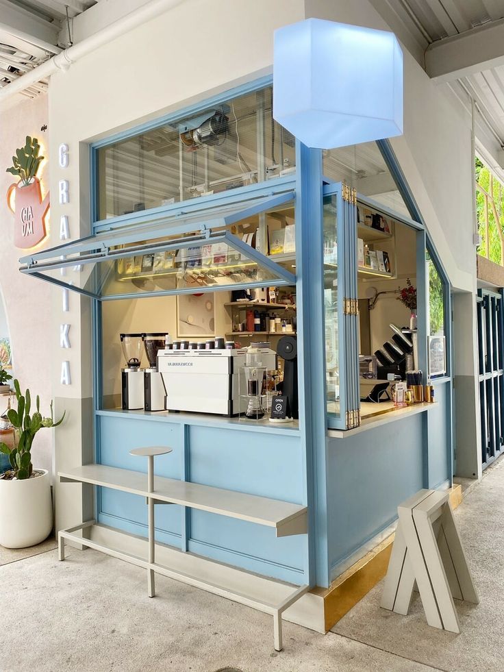 Modern Cafe Design: A Bright, Minimalist Aesthetic with Pastel Accents and Inviting Decor