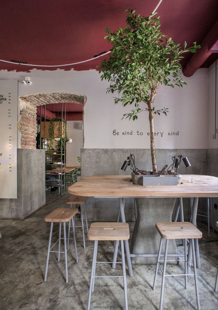 Inviting Cafe Design: A Harmonious Blend of Naturals and Industrial Aesthetics