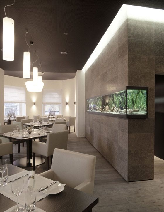 Modern Elegant Cafe Design: Inviting Atmosphere with Tranquil Aquarium and Minimalist Aesthetics