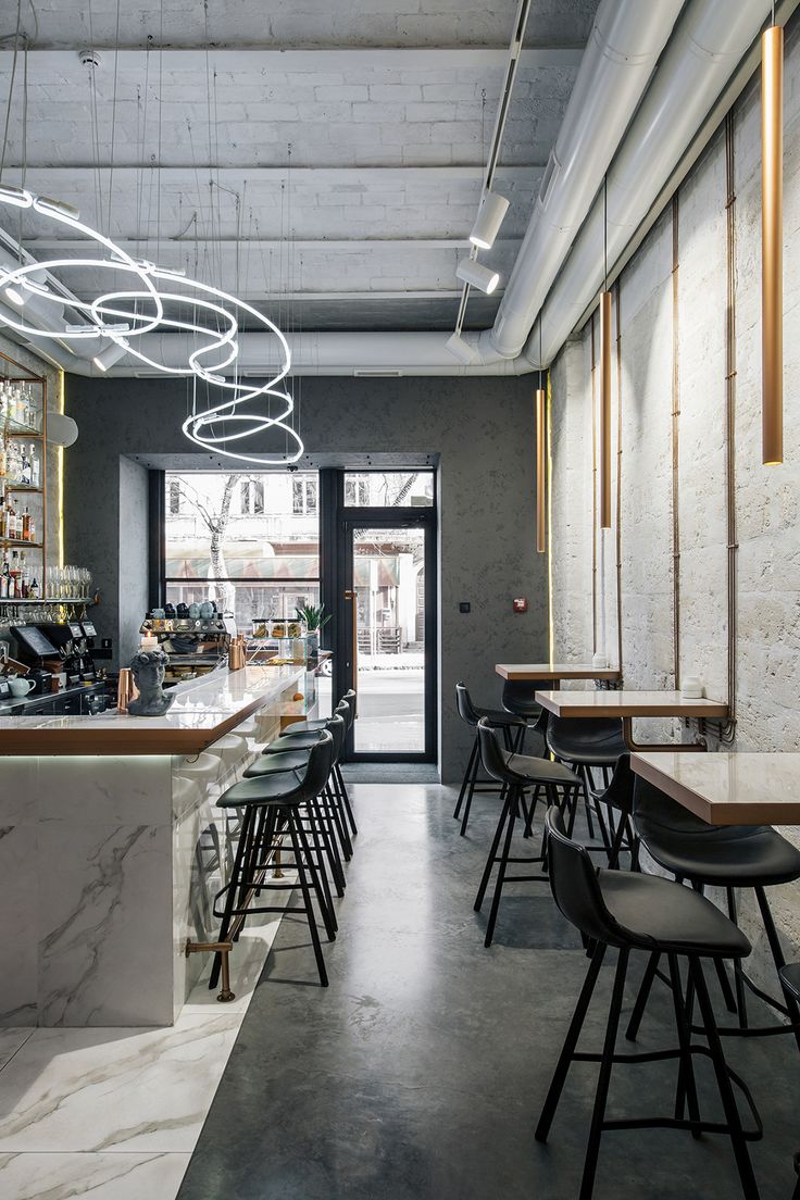 Modern Minimalist Cafe: Elegant Design with Industrial Charm and Inviting Ambiance