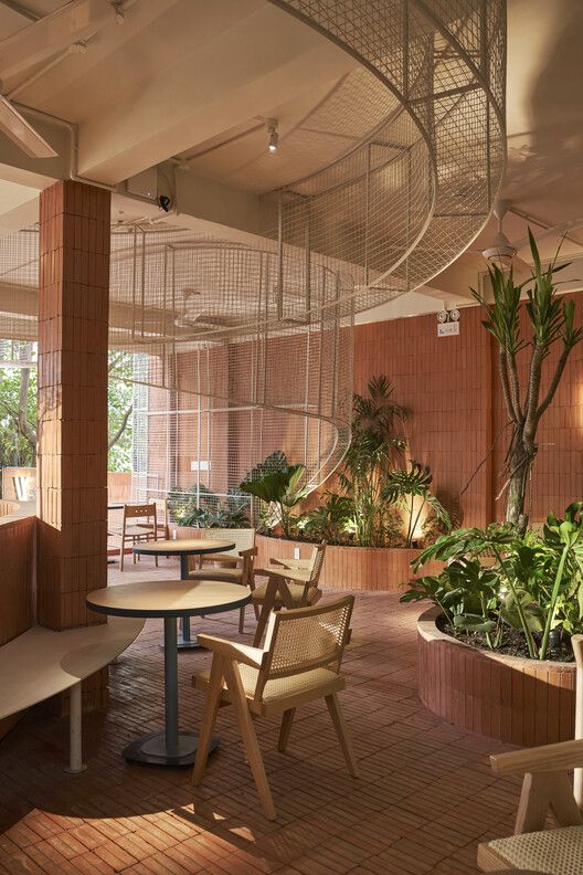 Elegant Cafe Design Merges Nature with Modern Aesthetics for a Welcoming Atmosphere