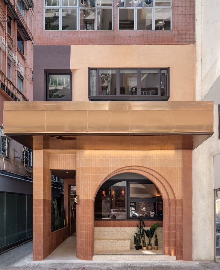 Striking Cafe Facade Blends Geometric Shapes and Warm Tones for an Inviting Atmosphere