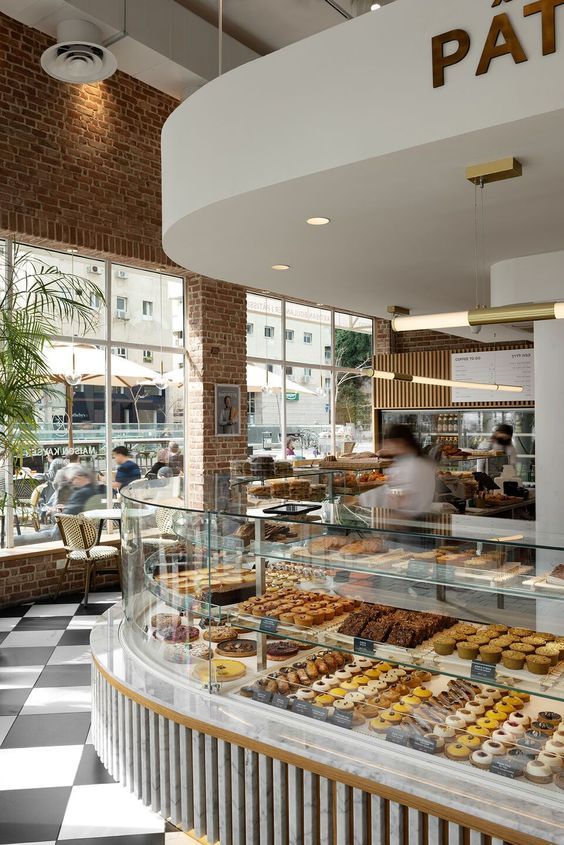 Inviting Cafe Design Blends Modern and Classic Elements with Natural Light and Vibrant Decor