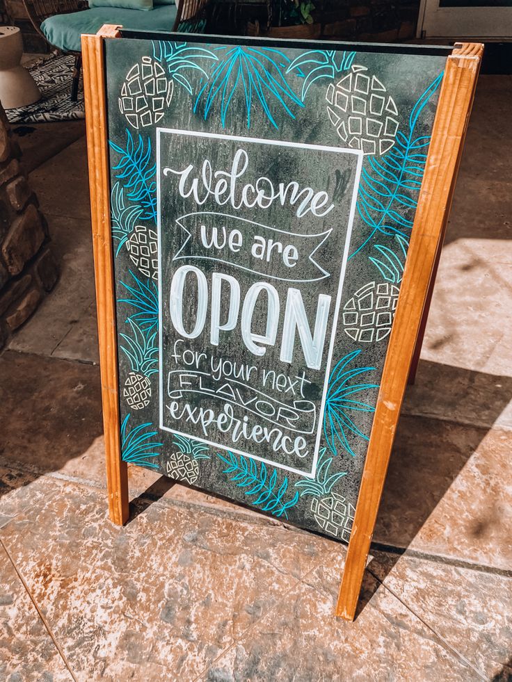 Charming Cafe Design with Rustic A-Frame Sign and Tropical Motifs Invites Culinary Adventure