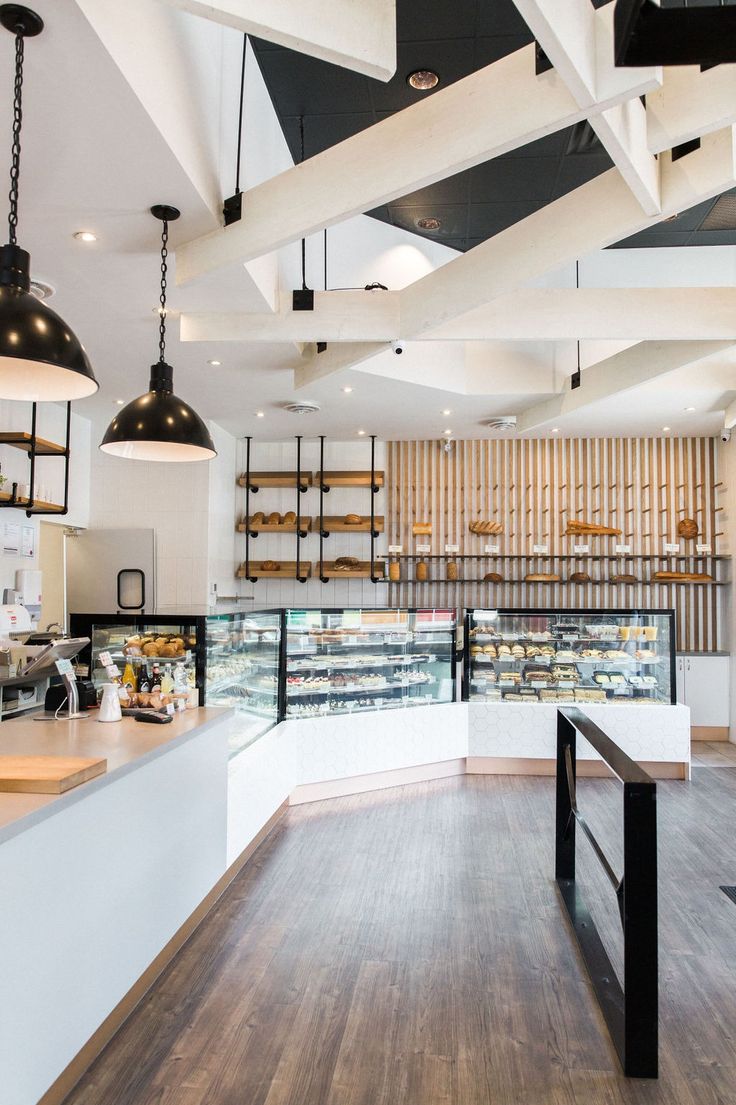 Modern Cafe Design: A Sleek, Airy Space with Warm Materials and Inviting Ambiance