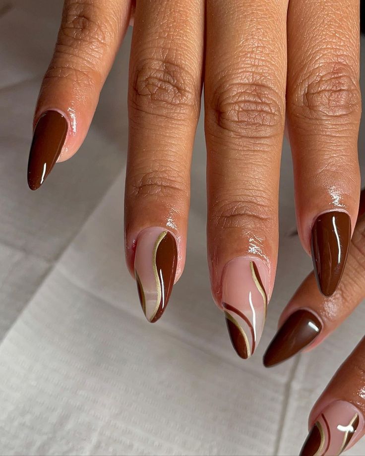 Chic Stiletto Nails: A Trendy Blend of Deep Browns and Nude Designs