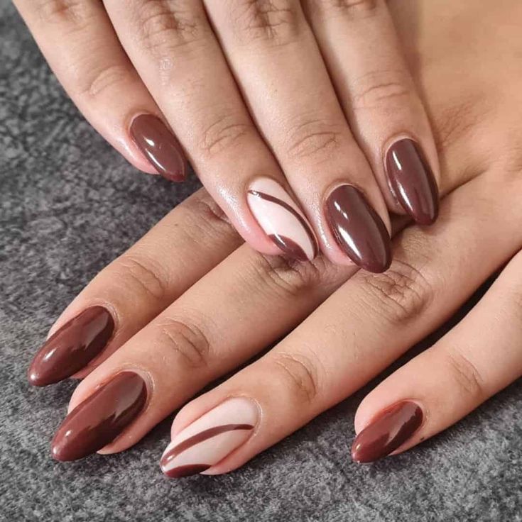 Chic Nail Design: Elegant Brown and Nude Shades with Artistic Swirls and Stripes