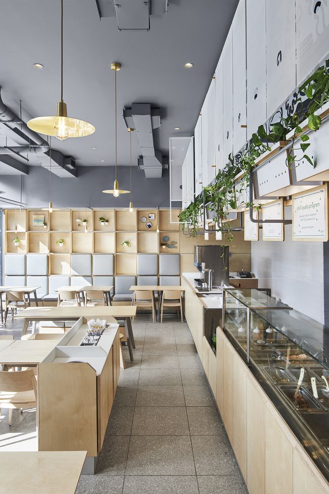 Modern Minimalist Cafe Design: Warm Atmosphere with Clean Lines and Inviting Layout