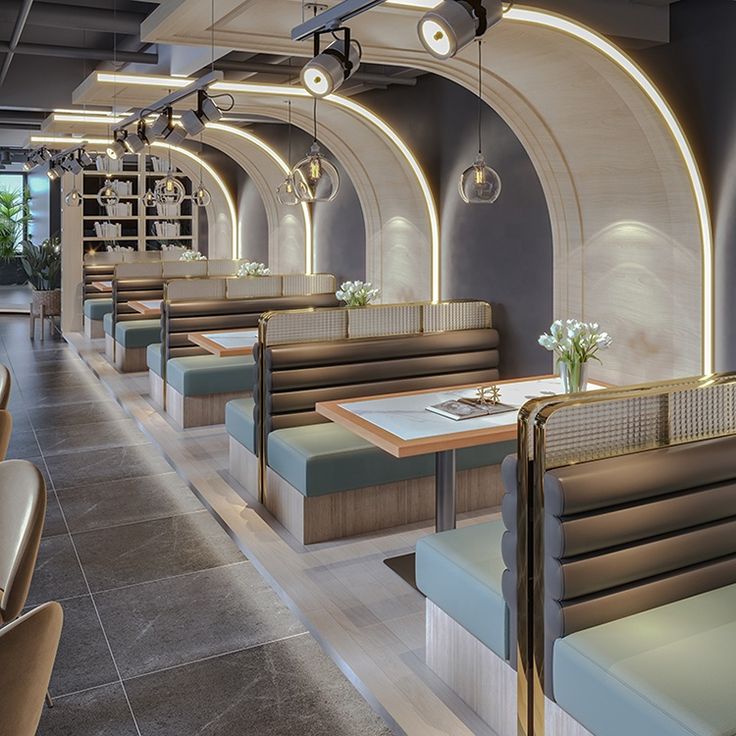 Elegant Modern Cafe Design with Curved Archways and Cozy Booths Promoting Social Interaction