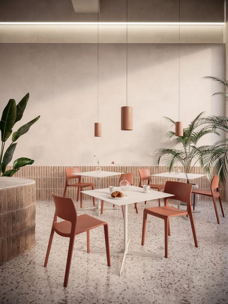 Minimalist Cafe Design: A Harmonious Blend of Earthy Tones, Natural Materials, and Inviting Greenery