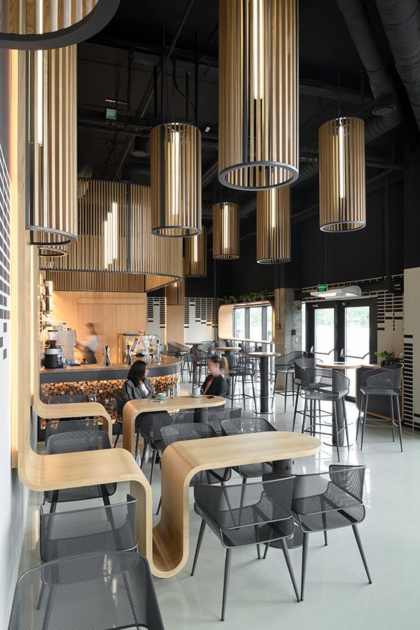 Modern Cafe Design Blends Warm Wood Texture with Industrial Elements for an Inviting Atmosphere