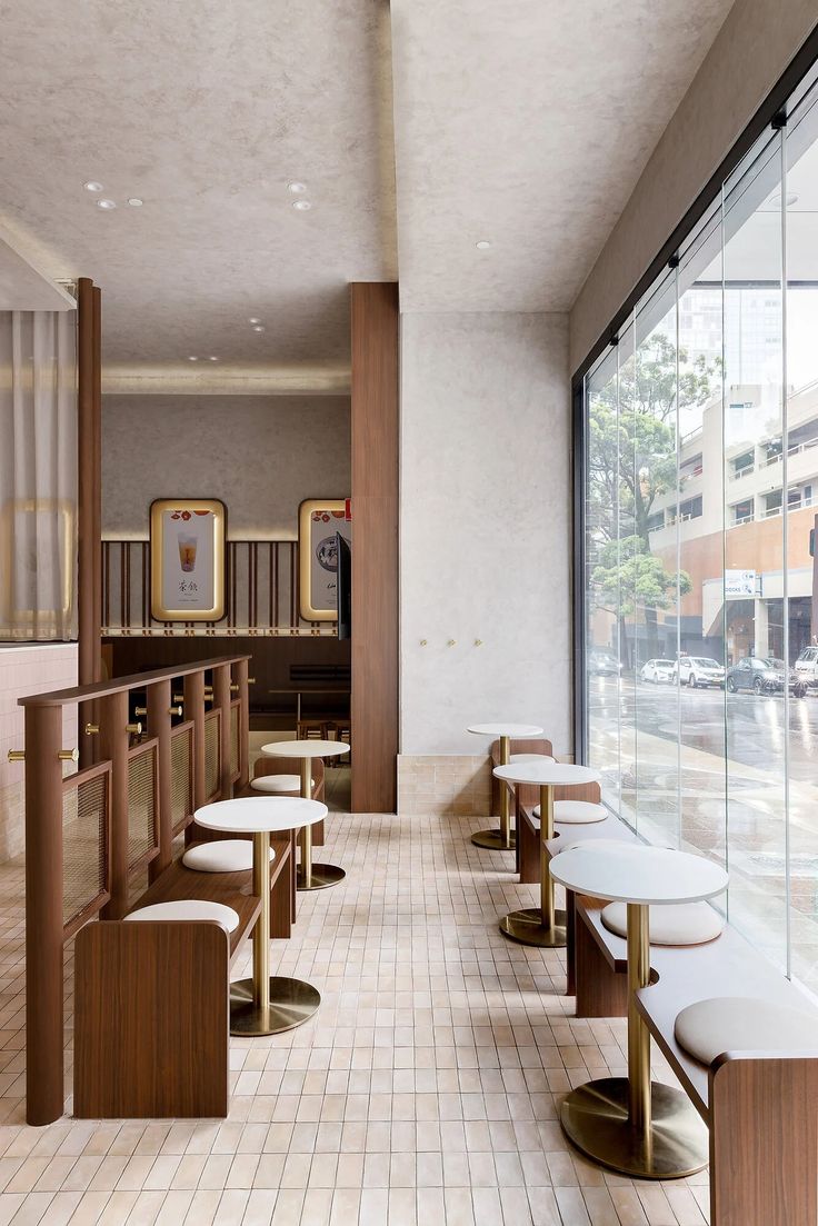 Modern Cafe Design: A Harmonious Blend of Warm Wood, Minimalist Furniture, and Inviting Ambiance