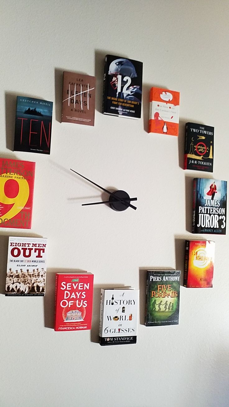 Artistic Book Wall and Clock Create Cozy, Intellectual Atmosphere in Cafe