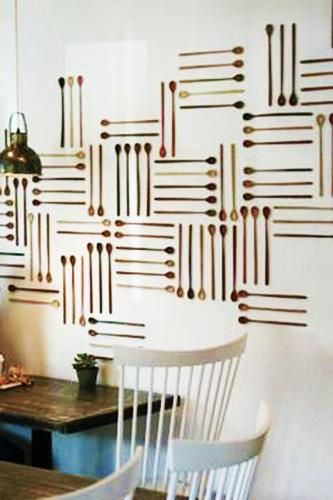 Cafe Design Highlights Whimsical Spoon Wall as Unique Art and Cozy Decor