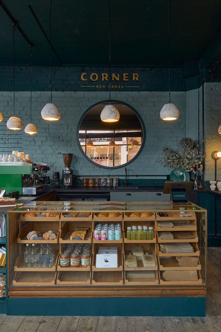 Inviting Cafe Design: A Harmonious Fusion of Modern and Rustic Elements with Calming Teal Accents