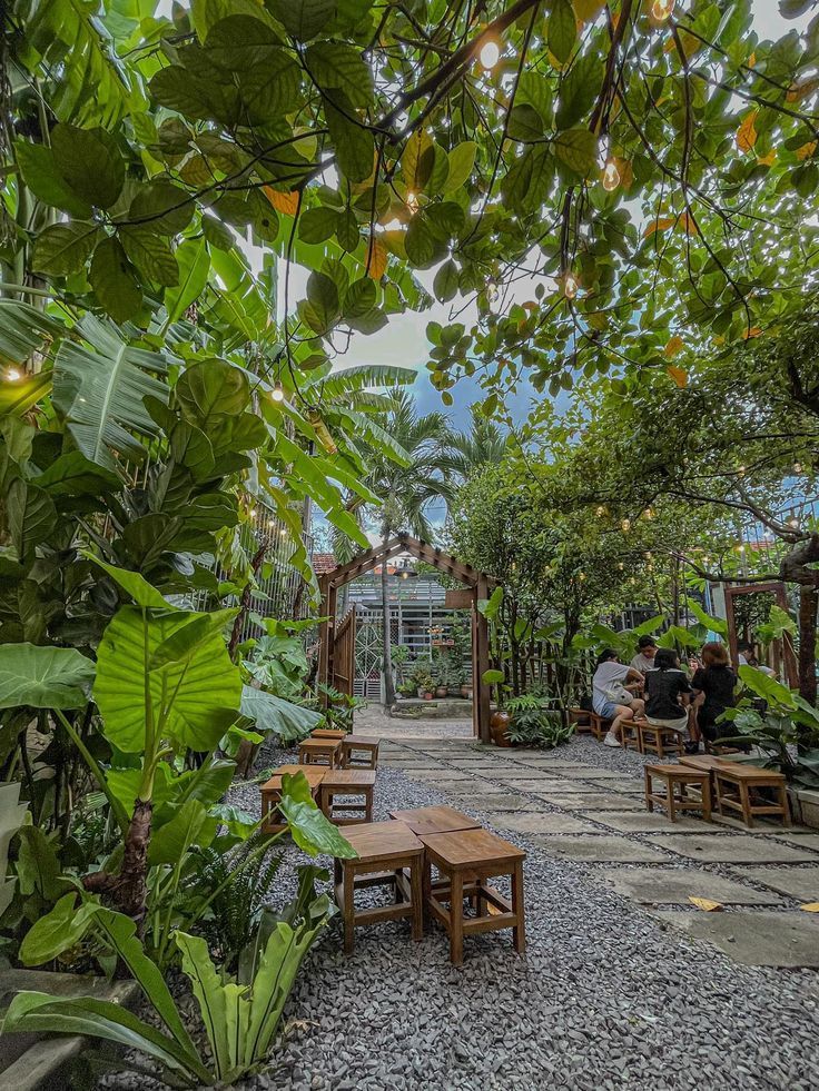 Charming Cafe Design Blends Lush Outdoors with Cozy Seating for Relaxation and Conversation