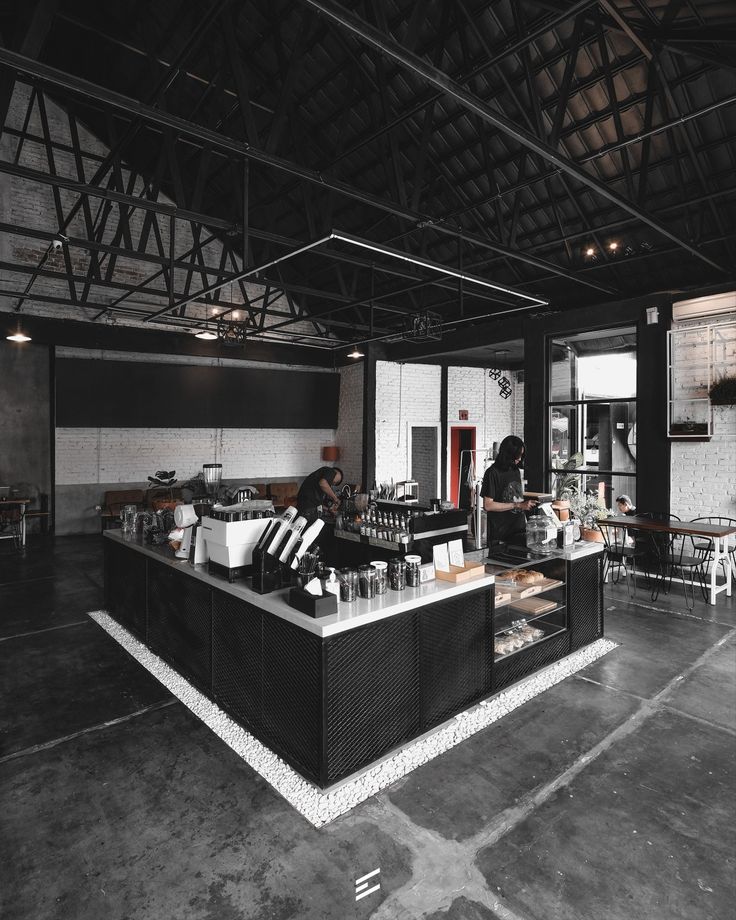 Spacious Industrial Cafe Design Blends Modern Aesthetics with Natural Light and Cozy Atmosphere