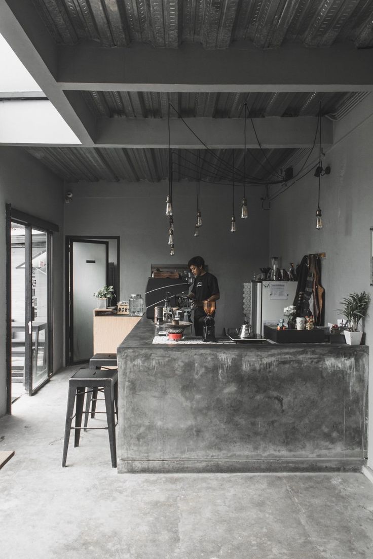 Minimalist Industrial Cafe Design with Serene Ambiance and Inviting Atmosphere