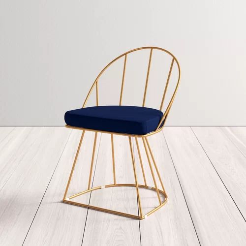 Modern Cafe Chair with Elegant Gold Wireframe and Deep Navy Cushion Enhances Stylish Atmosphere